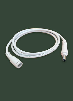 White medical cable on a dark green background