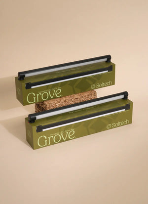 Two Black Soltech Grove plant grow lights in packaging, one above the other, with predominantly white and green colors.