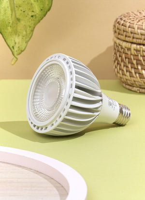 A white Soltech Vita displayed against a yellow background with a wicker object and a green leaf in the backdrop.