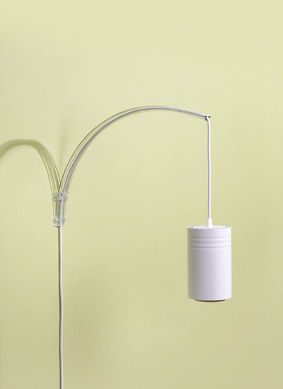 Soltech Archetto wall mount and white Soltech Aspect against a yellow background.