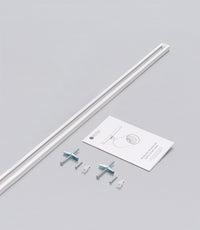 A Highland track rail system with components laid out on a white background, including mounting brackets and a power source not included note.
