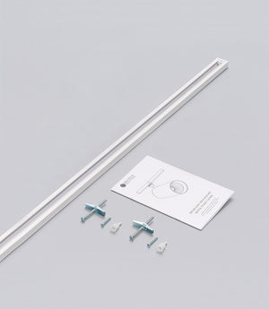 A Highland track rail system with components laid out on a white background, including mounting brackets and a power source not included note.
